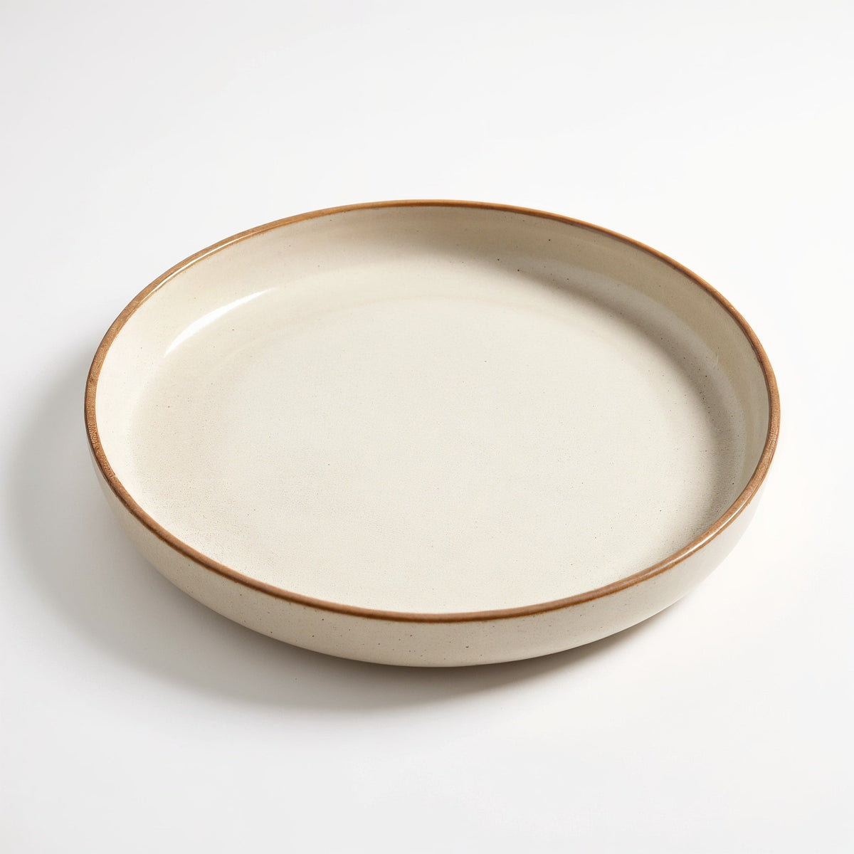 Danmero Alabaster Serving Plate — three-quarter angled view showing top face and rim