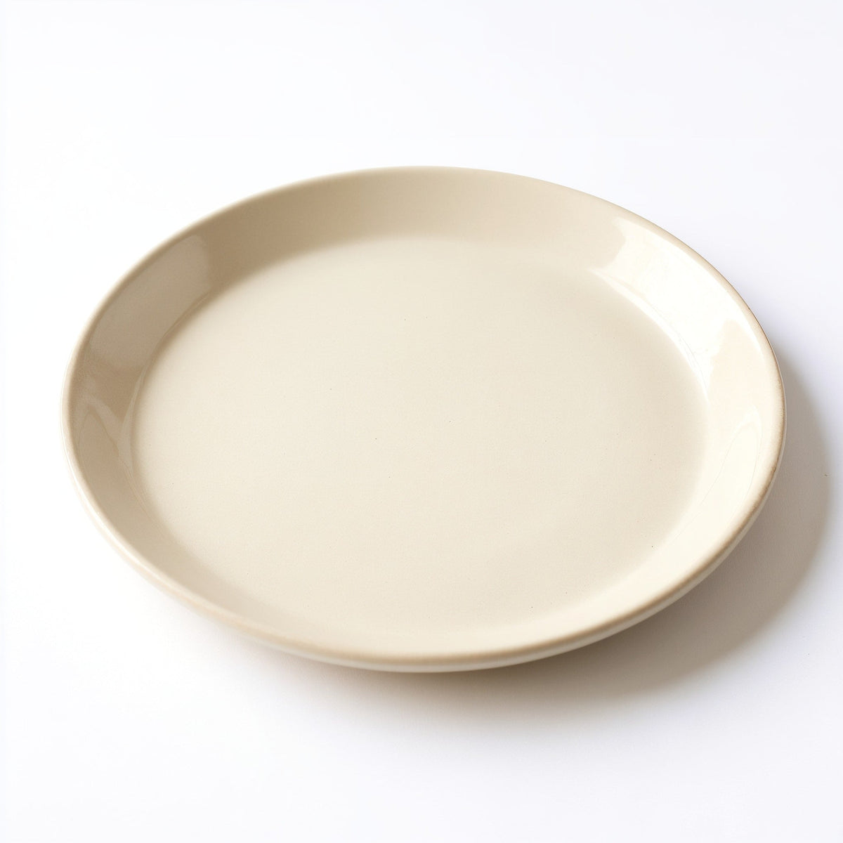 Danmero Ivory Serving Plate — three-quarter angled view showing full top face and rim