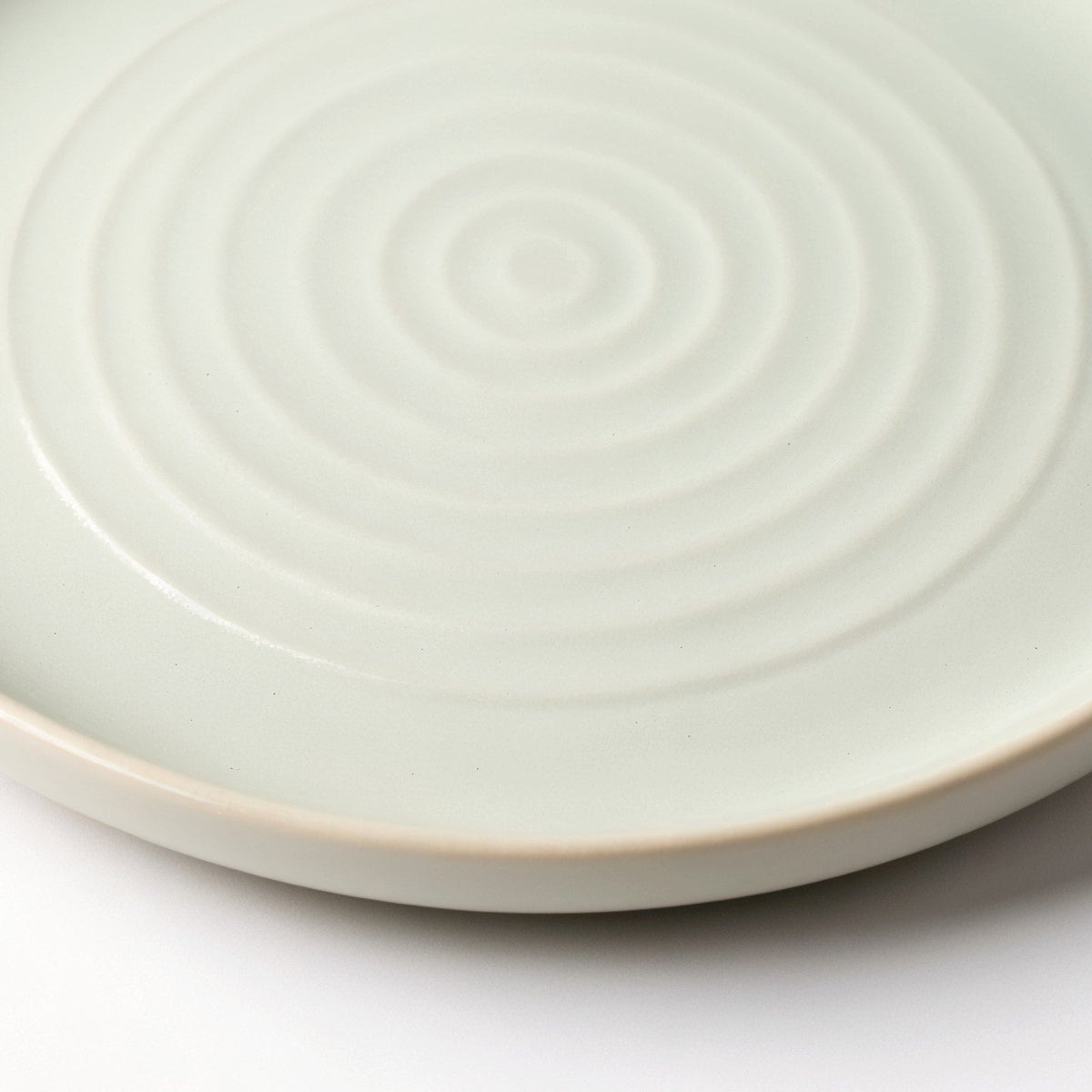 Danmero Celadon Dessert Plate — macro close-up of the raised rim and glaze pooling