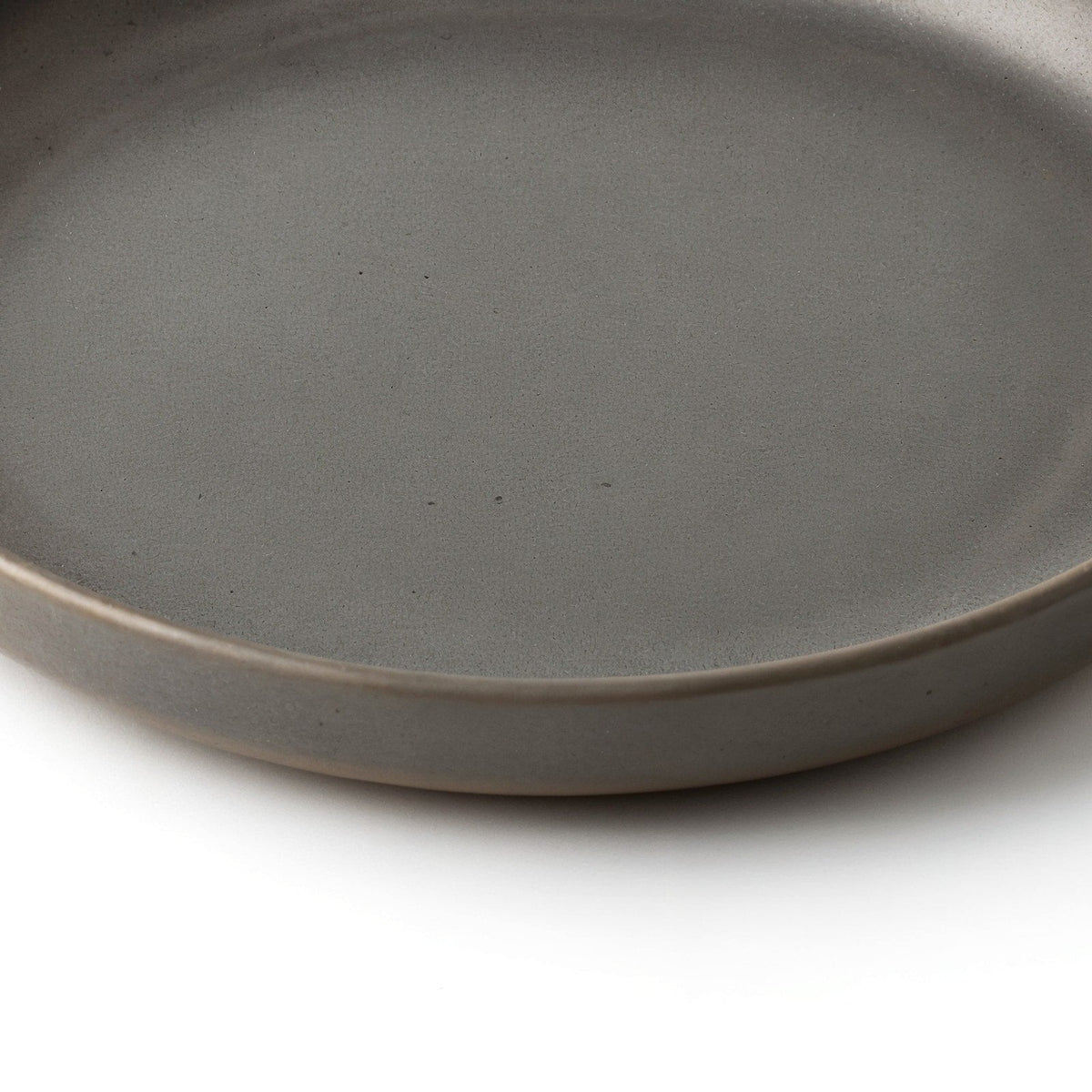 Danmero Charcoal Pasta Plate — macro view of raised rim and glaze pooling