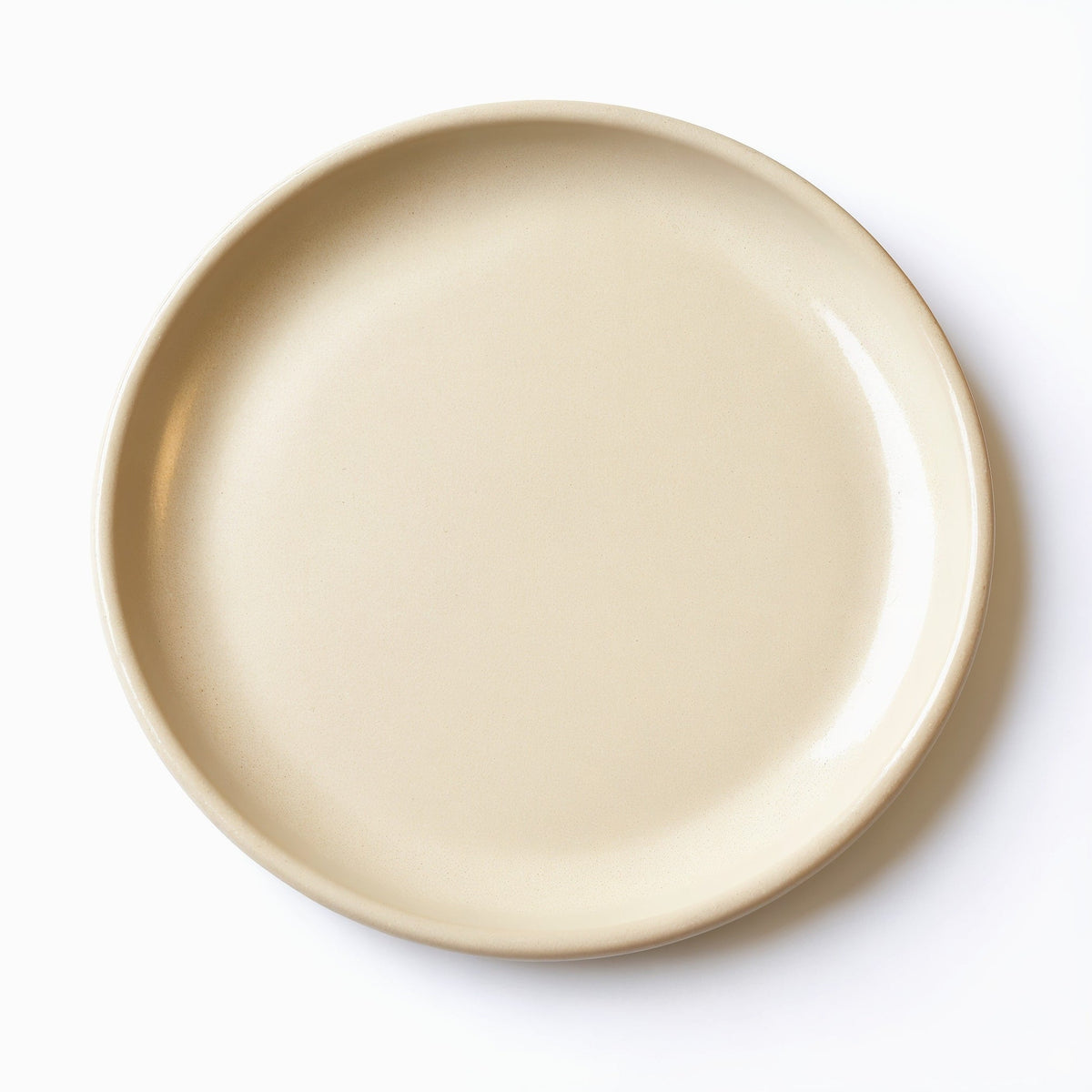 Danmero Flax Side Plate — top-down view showing full round face and glaze