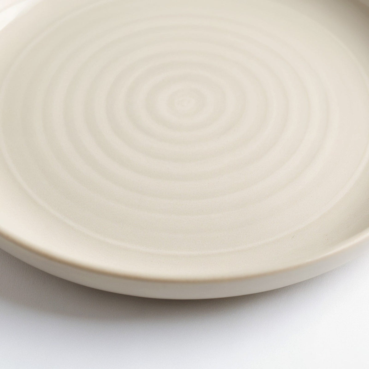 Danmero Mist Bread Plate — macro close-up of raised rim and glaze pooling