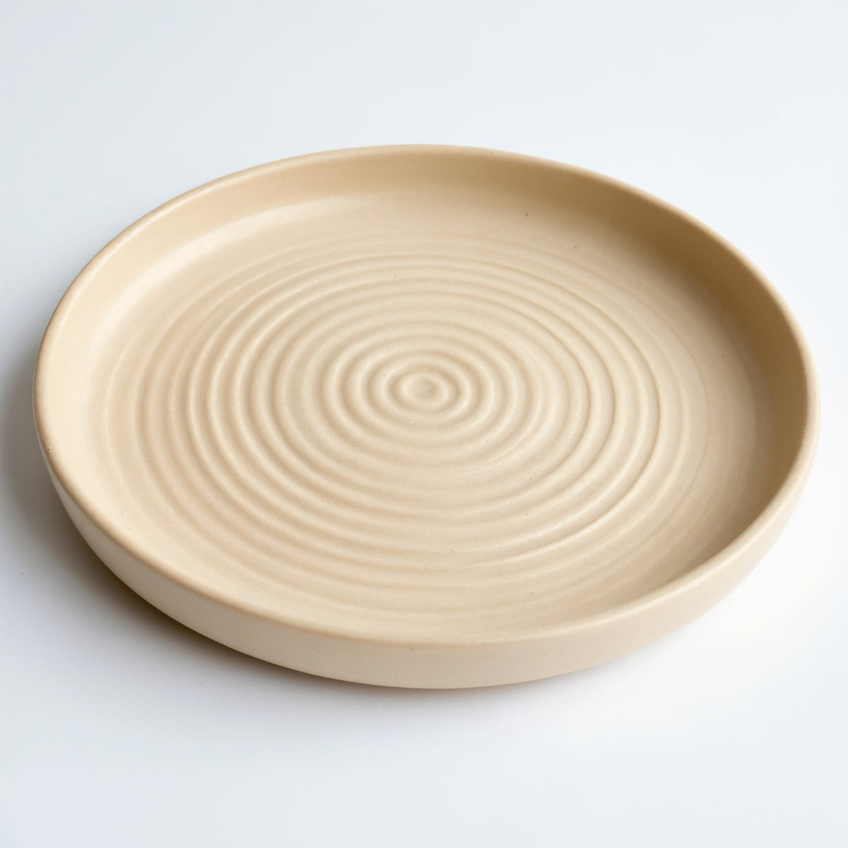 Danmero Parchment Bread Plate — three-quarter angled view showing the full top face and raised rim