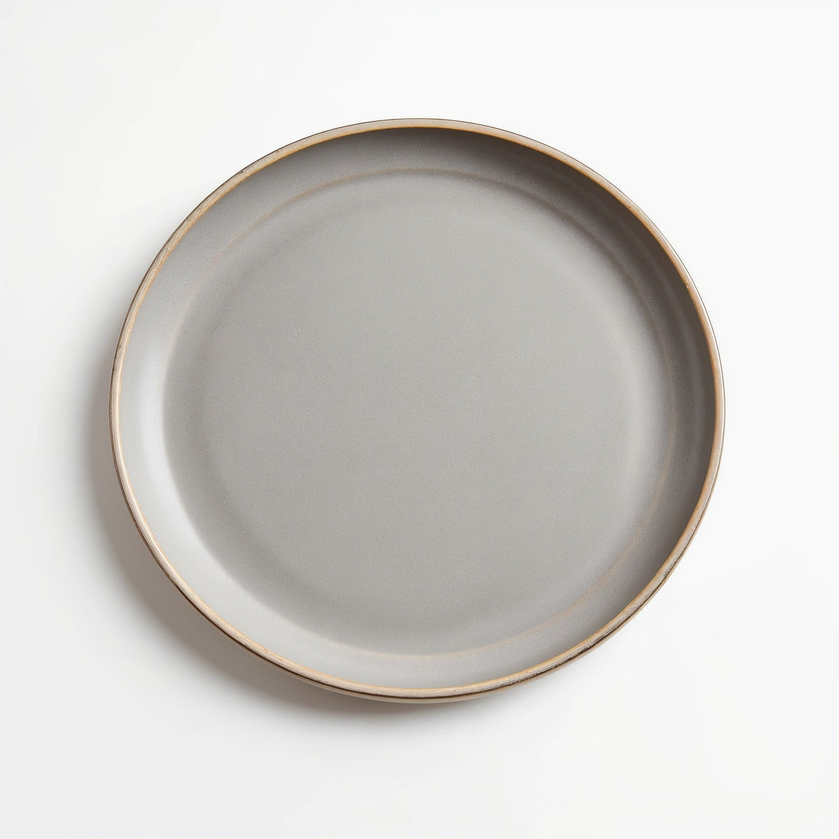 Danmero Pebble Dinner Plate — top-down view showing full round face and glaze