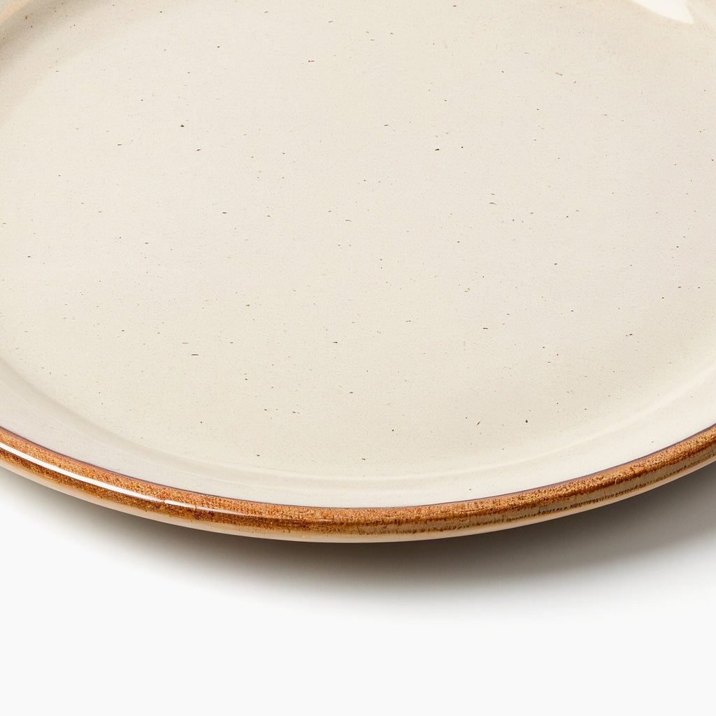 Danmero Sandstone Dessert Plate — macro close-up of the plate's raised rim and glaze pooling