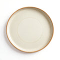 Danmero Eggshell Dinner Plate — strict top-down view showing full round face and glaze